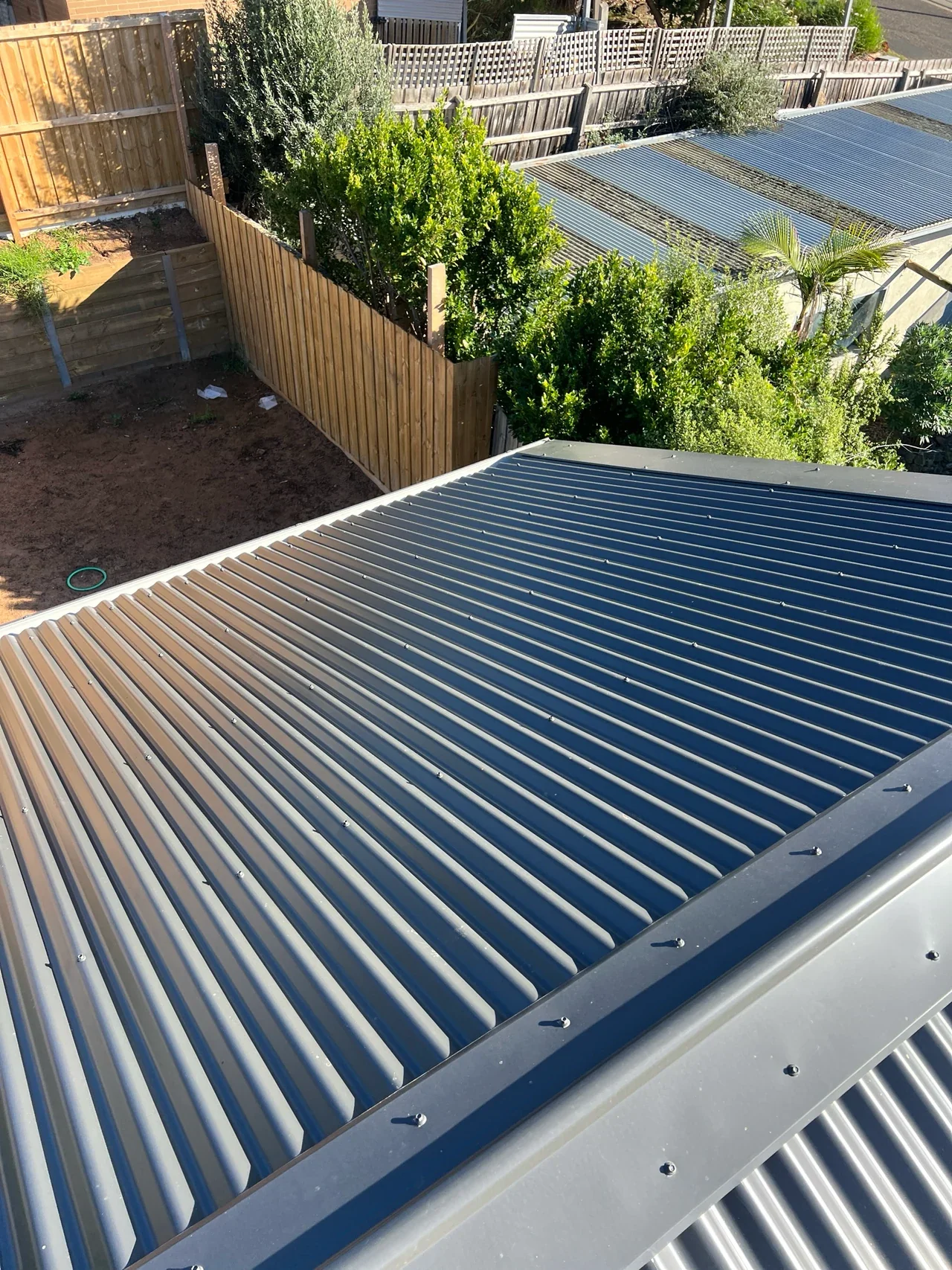 Metal roof sheets, fixings and adjoining flashing on a Flow-Rite job